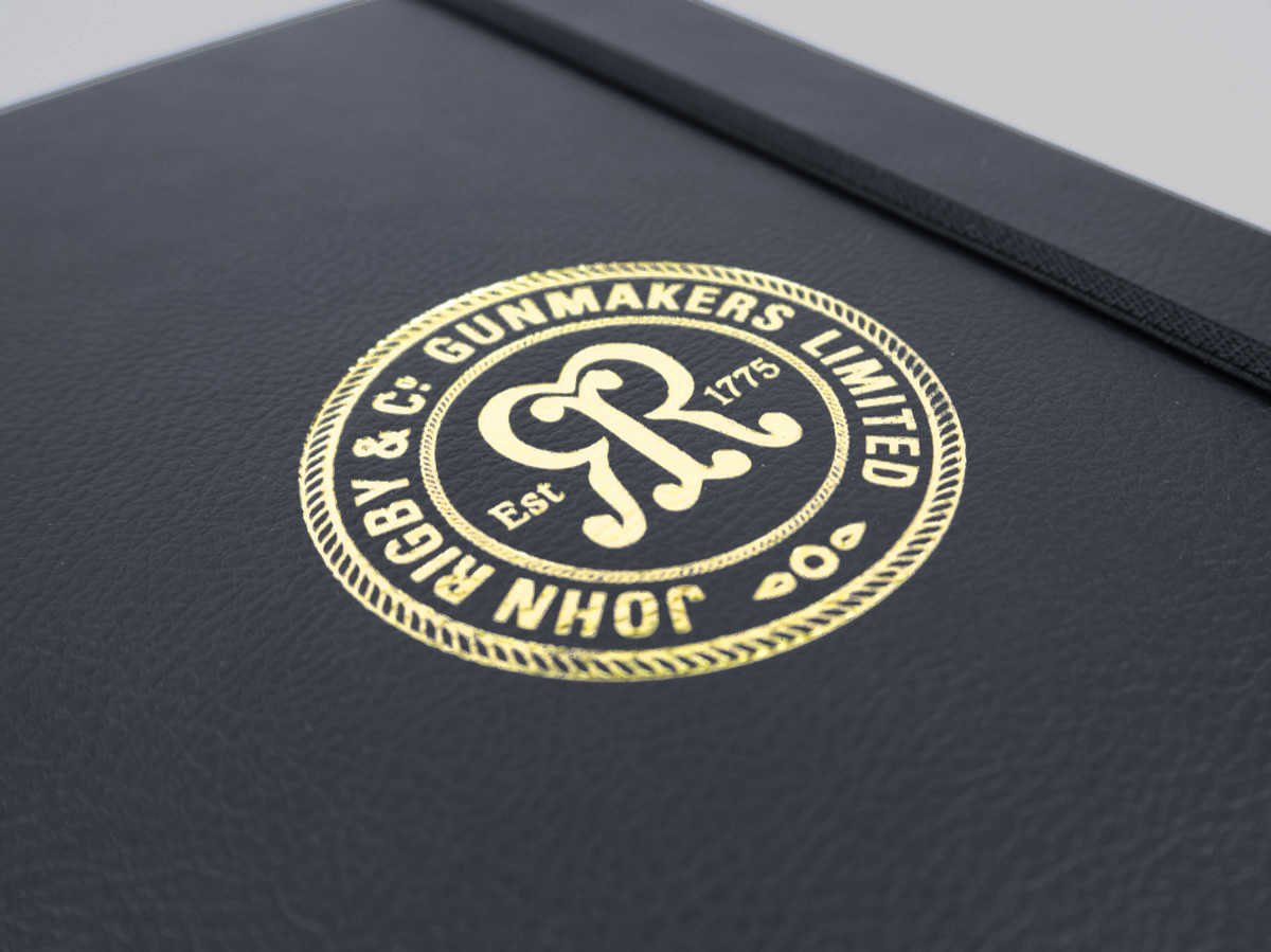 John Rigby custom notebook with gold edging and foil print logo