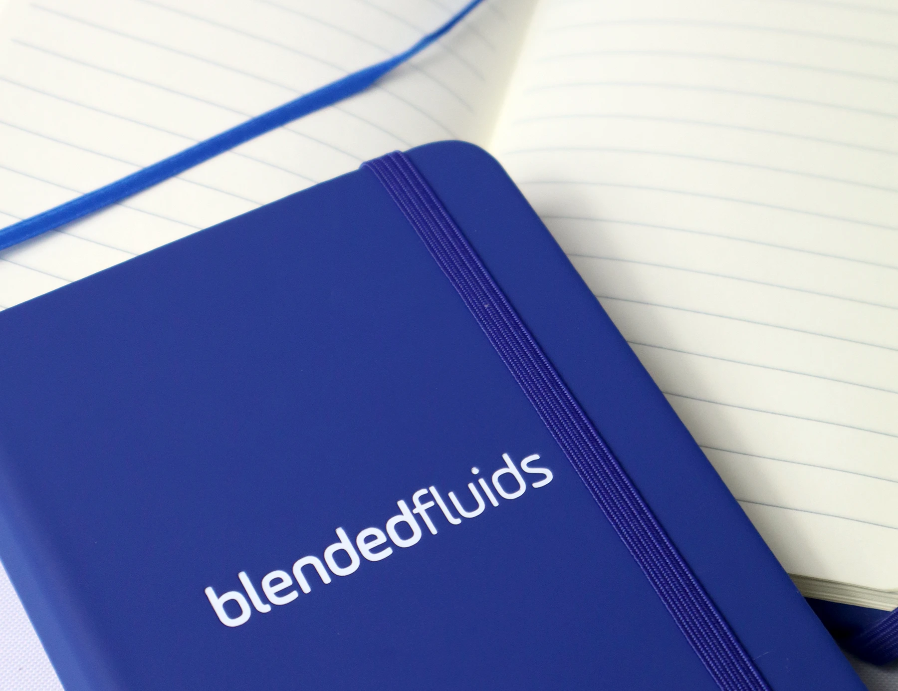 Blended fluids branded notebook in bright blue